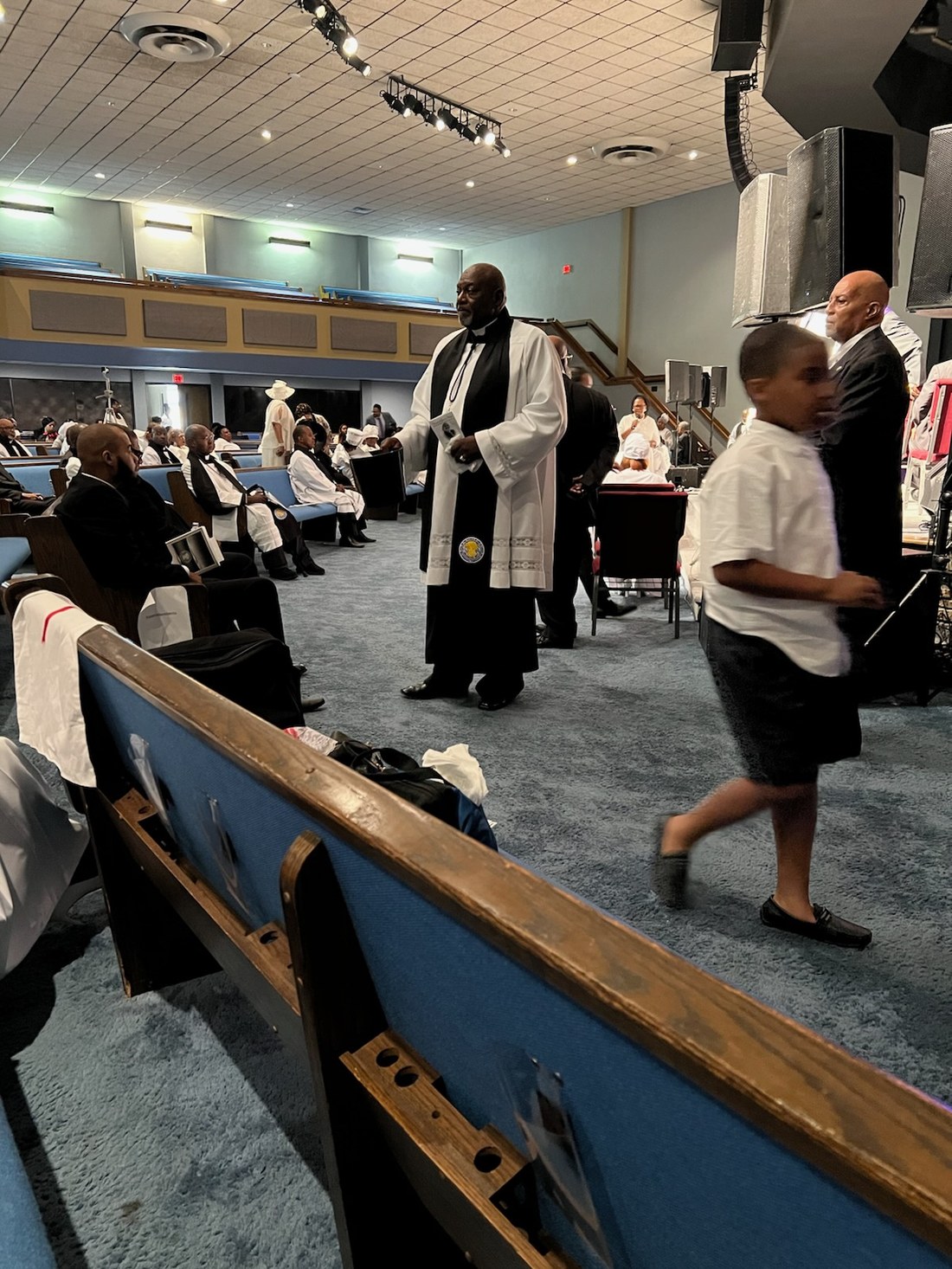 Pastor Rollins leading worship during a Holy Convocation service
