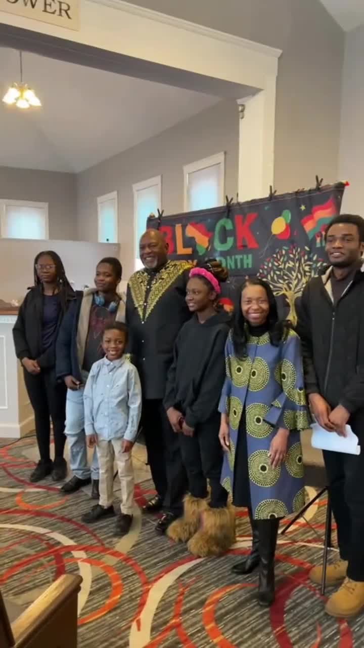 Pastor Rollins with the church's youth and families