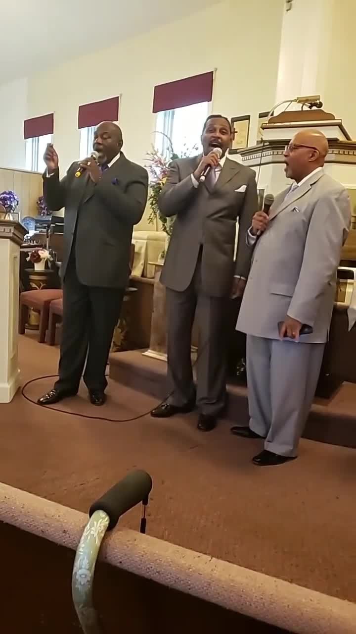 Men's ensemble singing during service