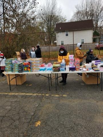 Volunteers distributing gifts at a Greater Mt. Olivet community outreach event