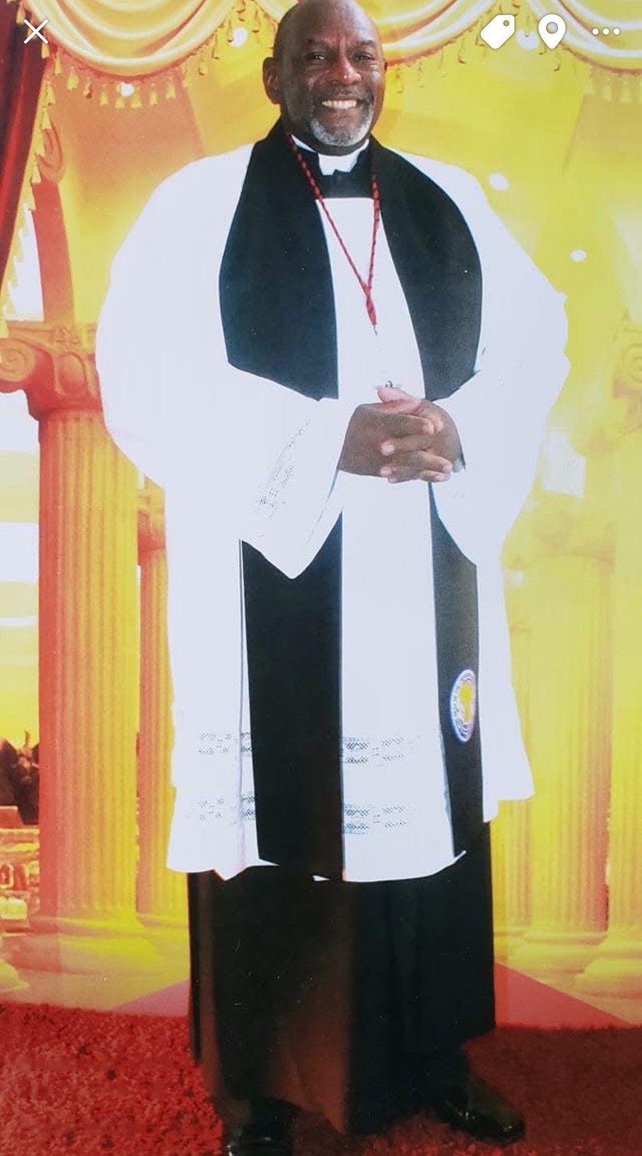 Pastor Claude Michael Rollins Jr. in clergy regalia